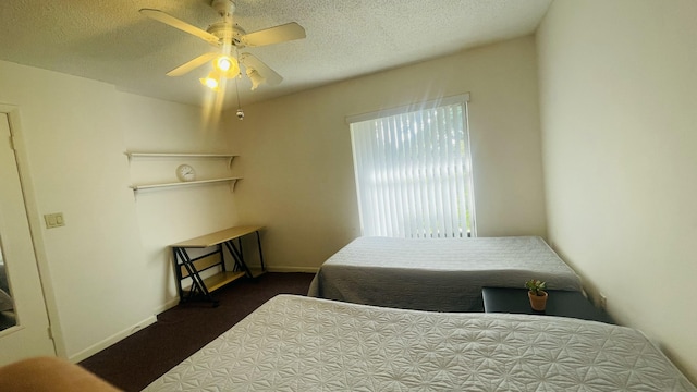 bedroom featuring ceiling fan and a textured ceiling