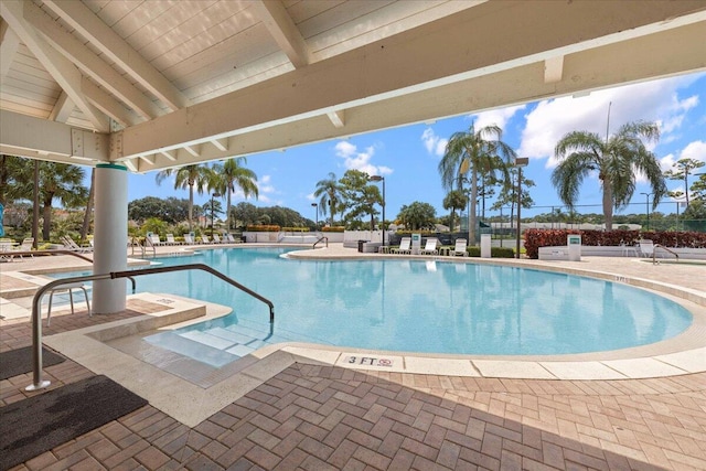 view of swimming pool with a patio