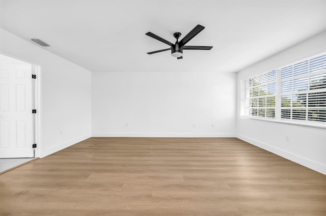 unfurnished room featuring ceiling fan and light hardwood / wood-style floors