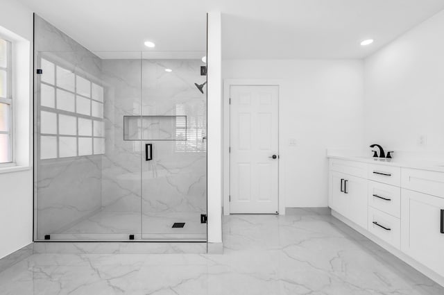 bathroom with vanity and an enclosed shower