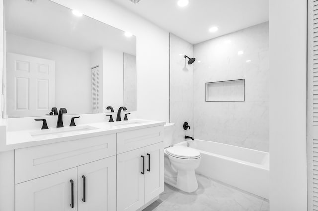 full bathroom with tiled shower / bath combo, toilet, and vanity