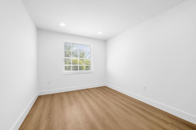 spare room featuring light hardwood / wood-style flooring