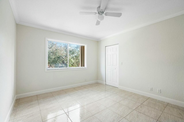 spare room with ceiling fan and ornamental molding