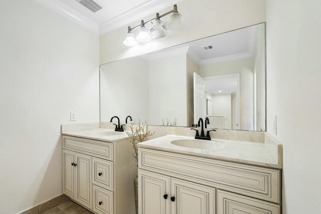 bathroom featuring crown molding, tile patterned flooring, and vanity