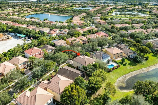 birds eye view of property featuring a water view