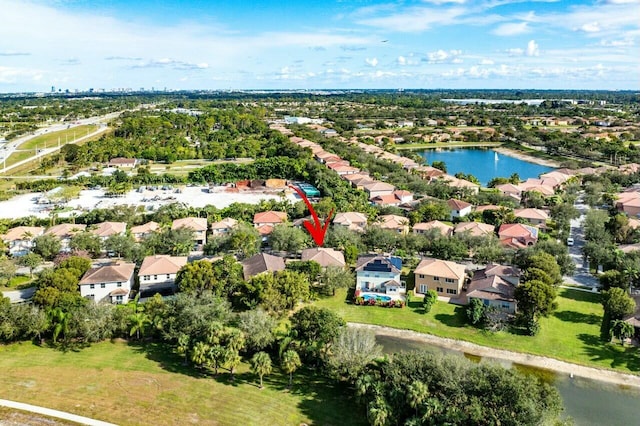 birds eye view of property featuring a water view