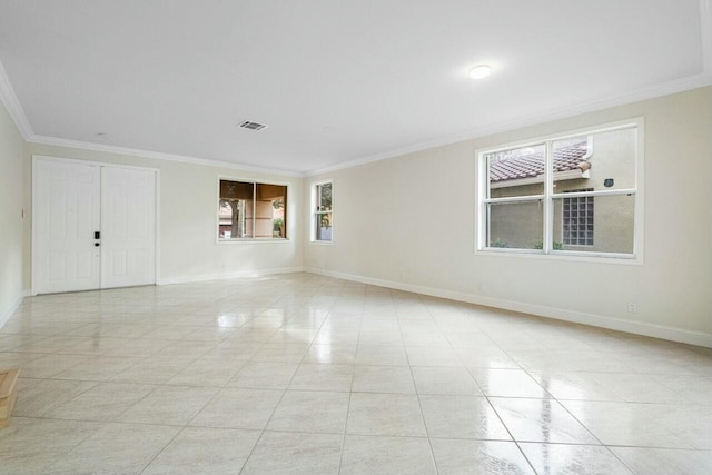 unfurnished room with crown molding