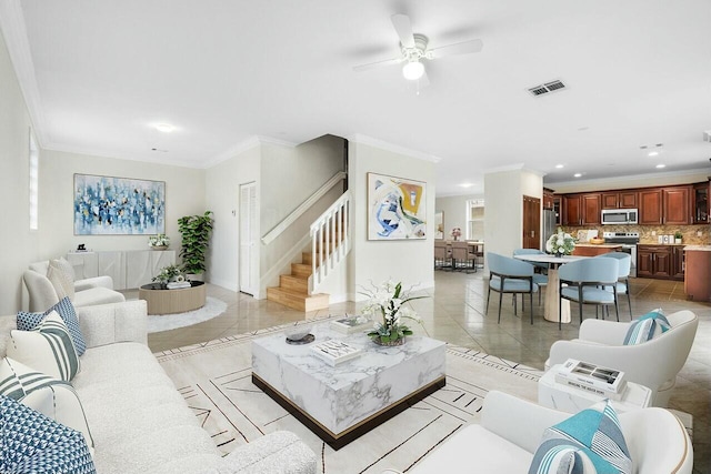 living room featuring ceiling fan, light tile patterned floors, and crown molding