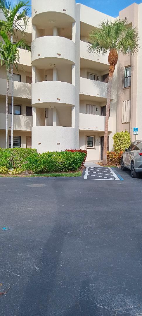 view of building exterior featuring uncovered parking