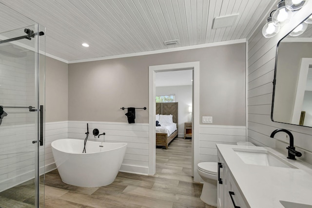 full bathroom with vanity, crown molding, toilet, independent shower and bath, and wood-type flooring