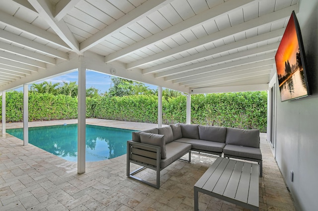 view of pool featuring an outdoor living space and a patio