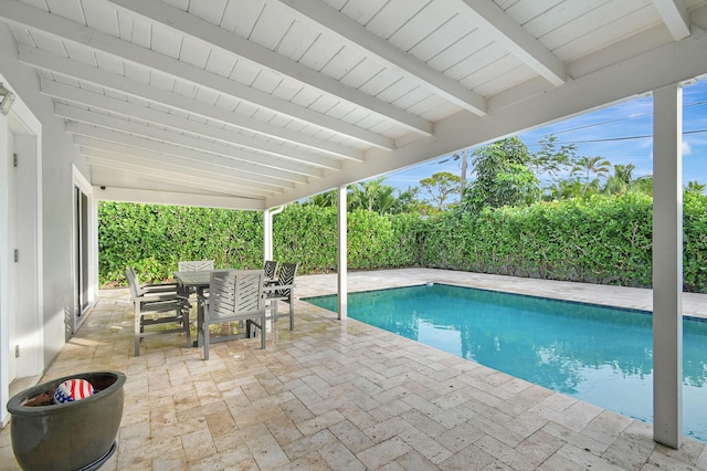 view of swimming pool featuring a patio area