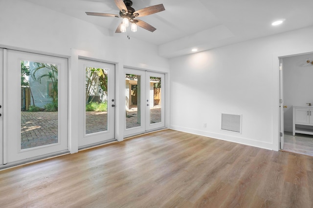 interior space featuring french doors, light hardwood / wood-style flooring, and ceiling fan