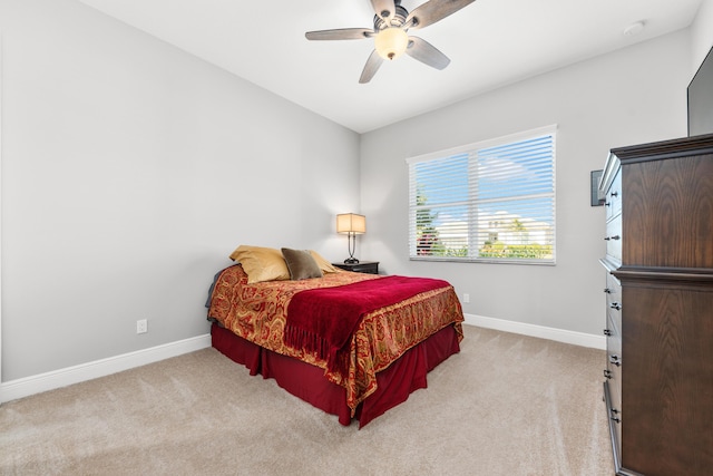 bedroom featuring ceiling fan and light colored carpet