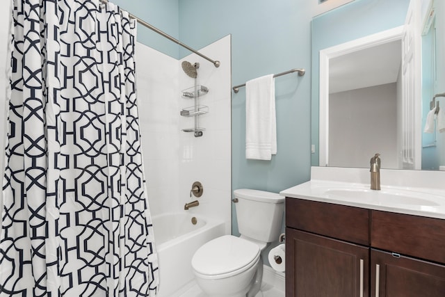 full bathroom with vanity, shower / bath combination with curtain, and toilet