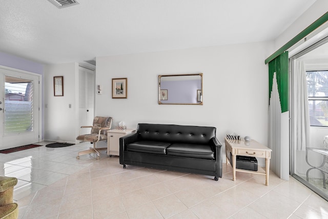 living room featuring light tile patterned floors