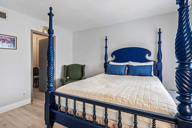 bedroom featuring hardwood / wood-style flooring