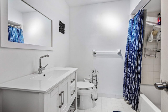 full bathroom with tile patterned floors, shower / bath combo with shower curtain, vanity, and toilet