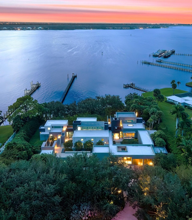 aerial view at dusk with a water view