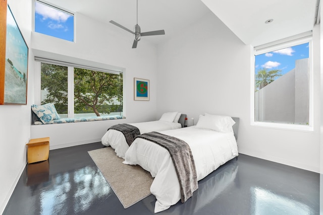 bedroom with ceiling fan and multiple windows