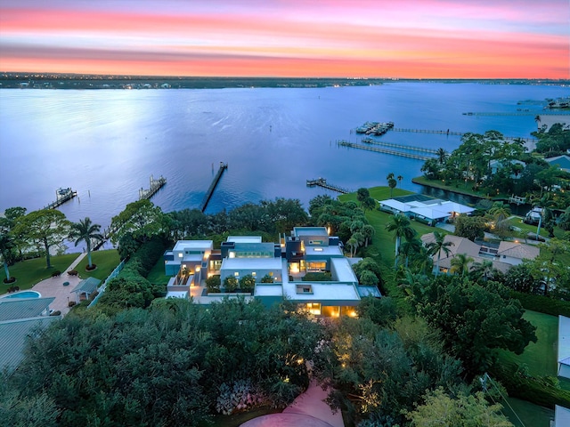 aerial view at dusk with a water view