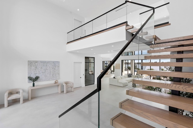 stairway with a towering ceiling