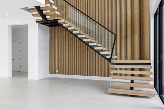 stairs with concrete floors