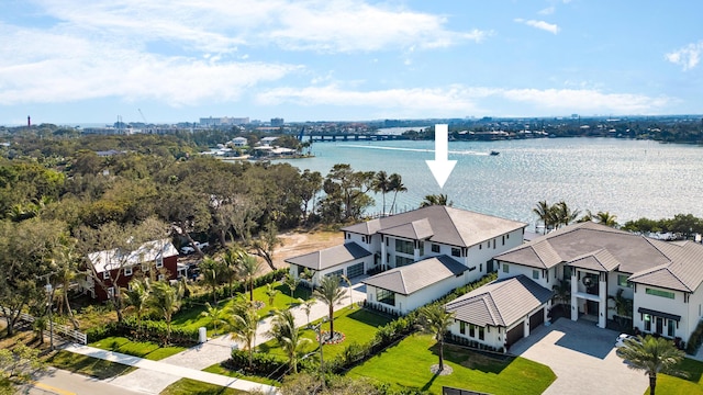 birds eye view of property with a water view