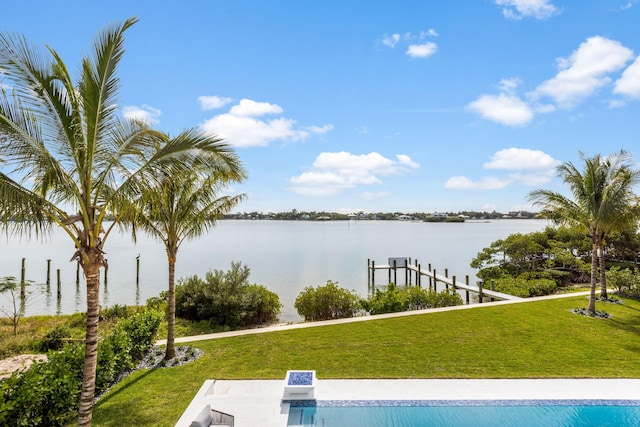 exterior space with a water view and a yard