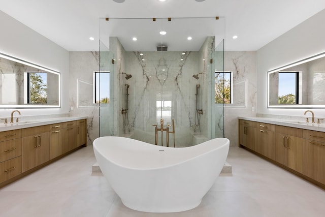 bathroom with vanity, plus walk in shower, and tile walls