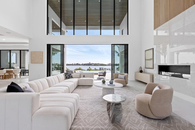 living room featuring a towering ceiling