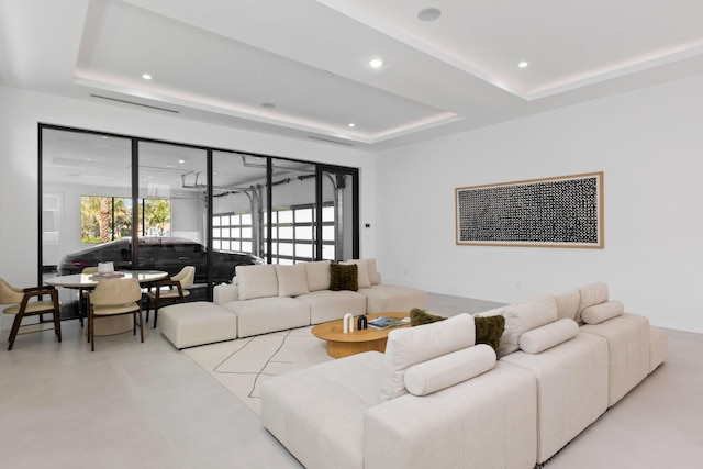 living room featuring a tray ceiling