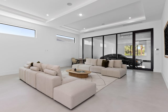 living room featuring a tray ceiling