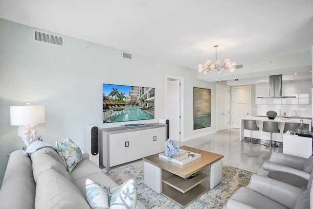 living room featuring a notable chandelier