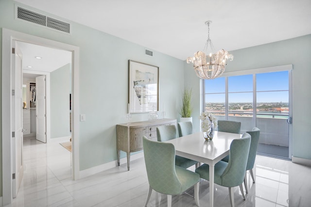 dining room featuring light tile patterned floors and a chandelier