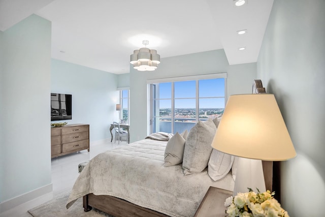 bedroom featuring a notable chandelier