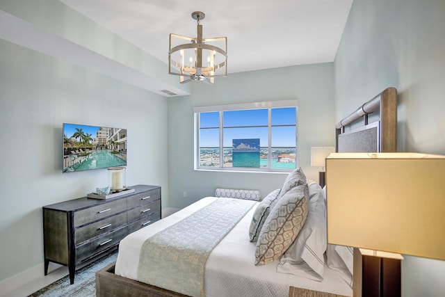 bedroom featuring an inviting chandelier