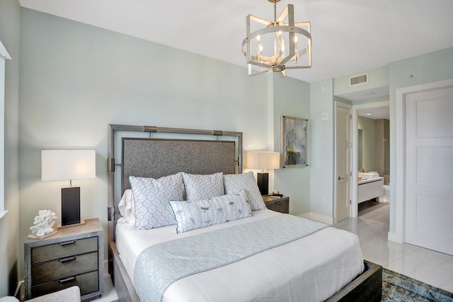 bedroom with an inviting chandelier and ensuite bath