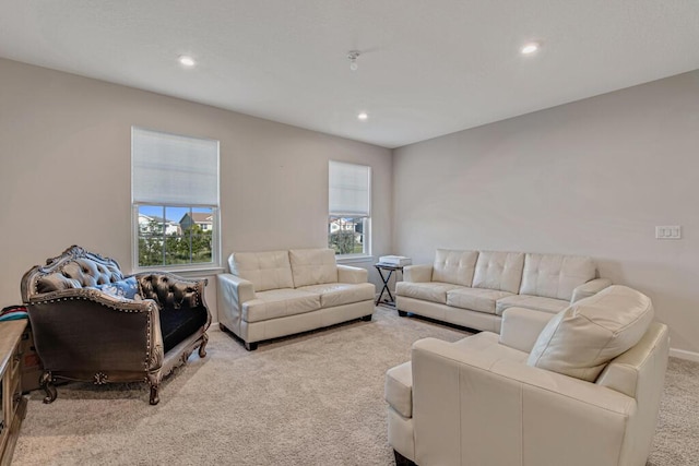 living room with light colored carpet and a wealth of natural light