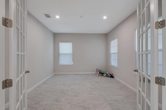 empty room featuring french doors