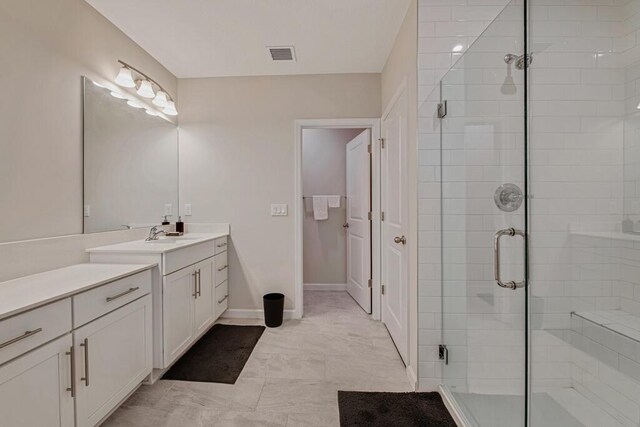 bathroom featuring vanity and walk in shower