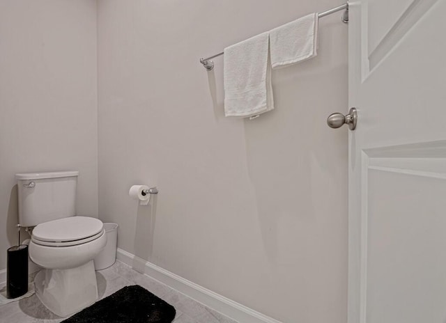 bathroom featuring tile patterned floors and toilet