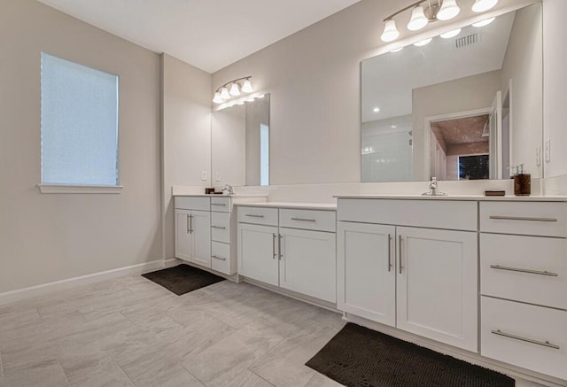 bathroom with vanity and walk in shower