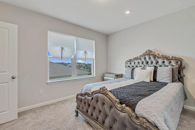 bedroom featuring light carpet