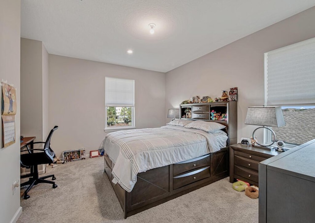 bedroom with light carpet