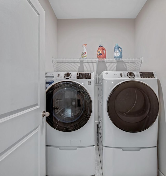 laundry room featuring washing machine and dryer