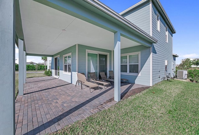 back of house with a yard and central AC