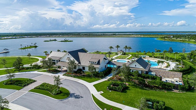 birds eye view of property with a water view