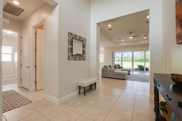 hallway featuring light tile patterned floors