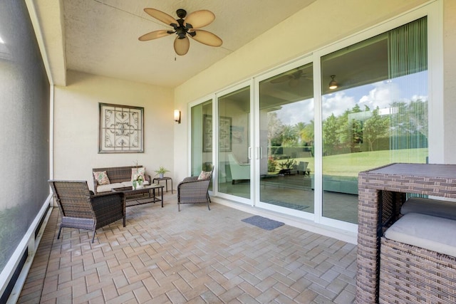 view of patio featuring ceiling fan